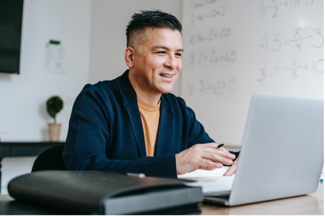 A man using Microsoft Teams knowing his account is secure and compliant.