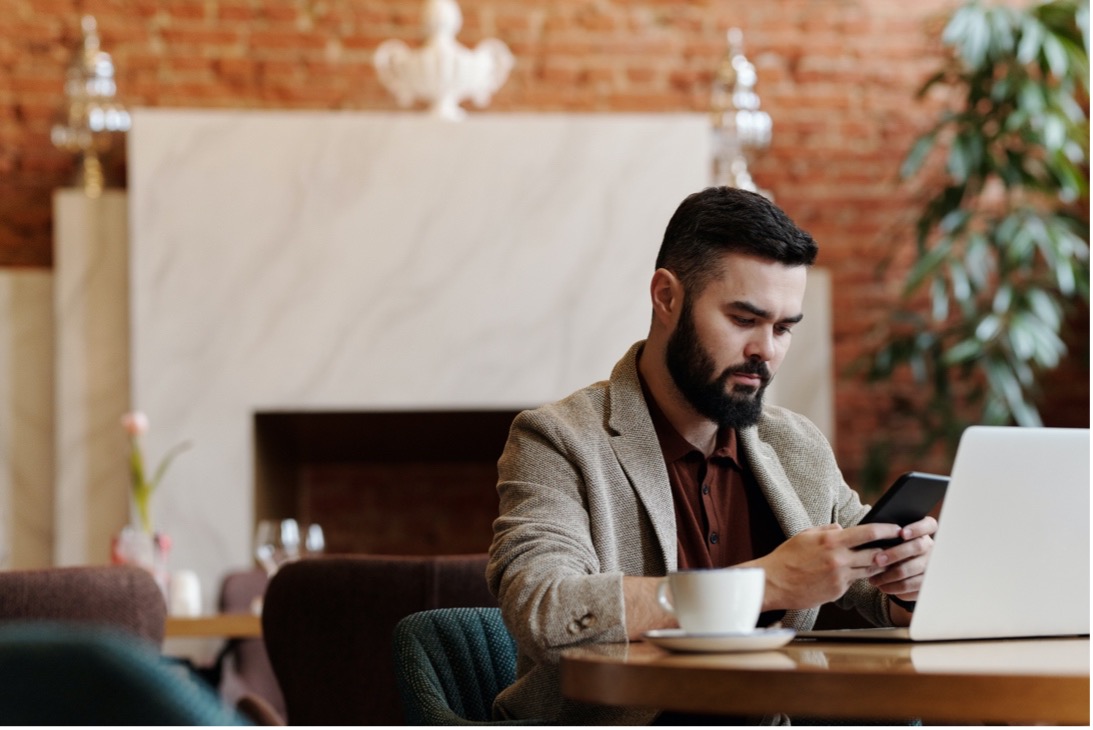 Man works remotely with Microsoft next generation endpoint solutions managing his desktop for hybrid work.