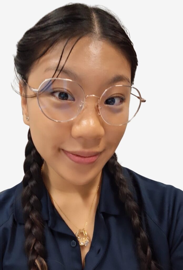Grace Quach, Zetta's UX/UI designer, smiling in glasses and a navy polo