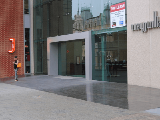 Glass and stone office entrance on a Perth city street